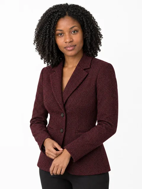 Fictional woman wearing the burgundy tweed blazer shown in the product reference photograph